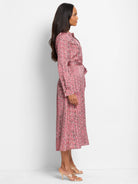 Red and cream herringbone midi dress with long sleeves and tie waist.