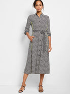 Off-white midi dress with black polka dots and lime green side panels.  Belted waist, button front.