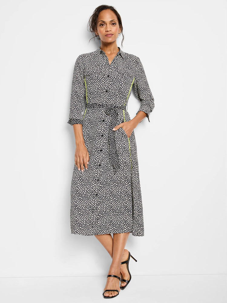 Black and off-white midi shirt dress with small dark spots.  Features a lime green side seam detail and a self-tie belt.