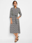 Black & off-white spotted midi shirt dress; 3/4 sleeves; lime green side trim; belted waist.
