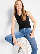 Black sleeveless knit tank with a rounded neckline.