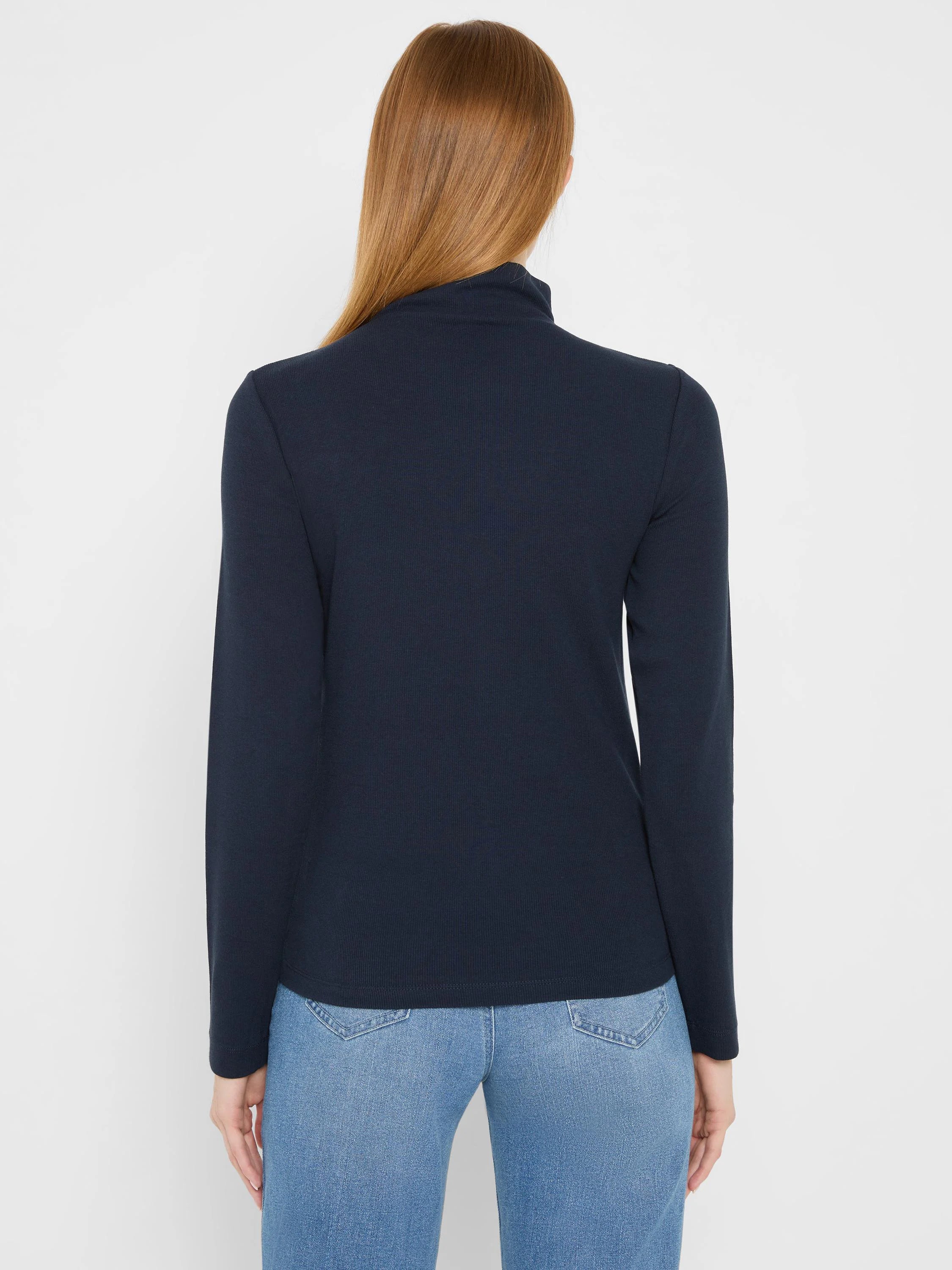 Dark navy ribbed knit mock neck long sleeve tee, worn from behind.