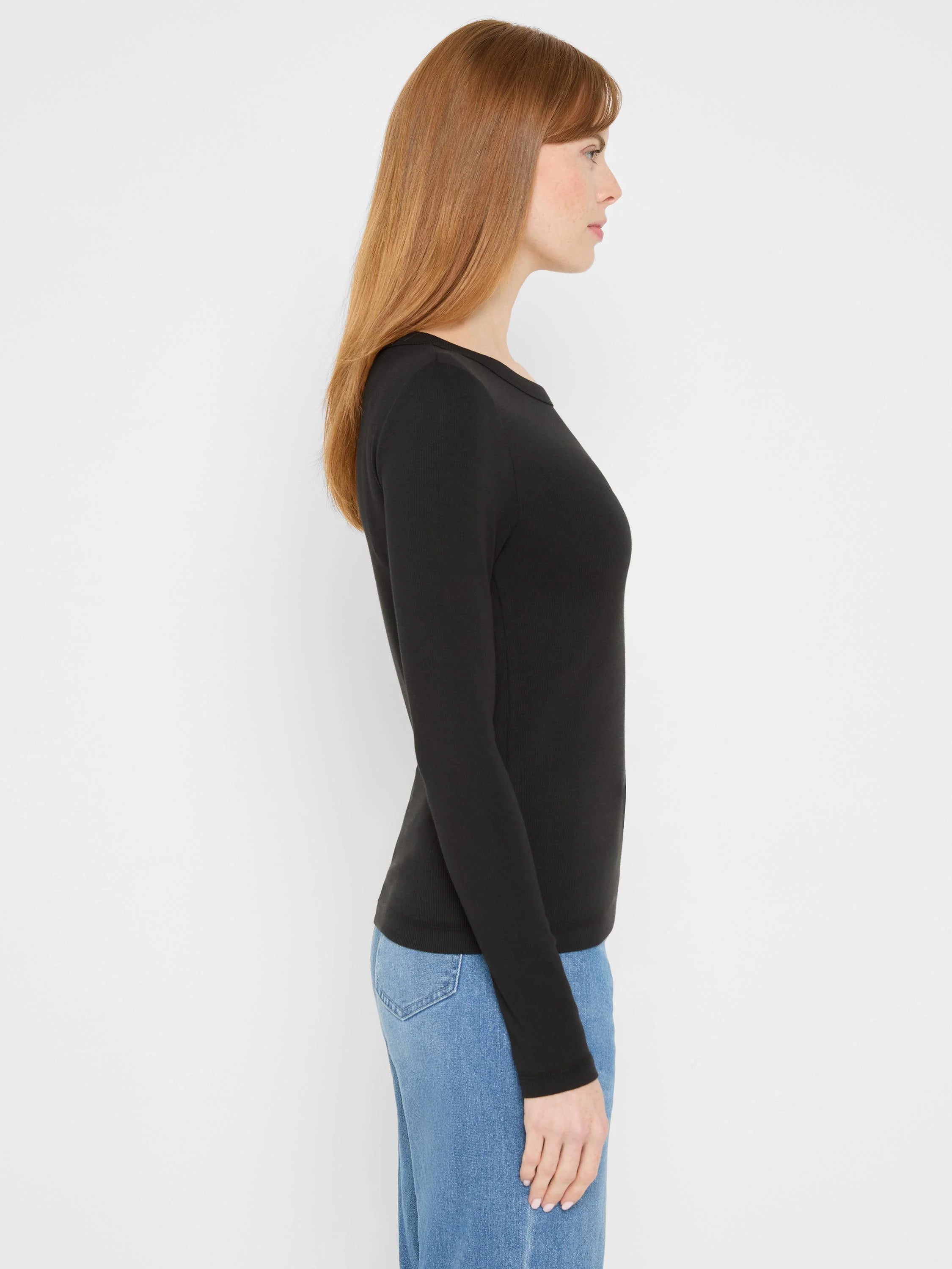 Fitted black ribbed knit long sleeve crew neck tee.
