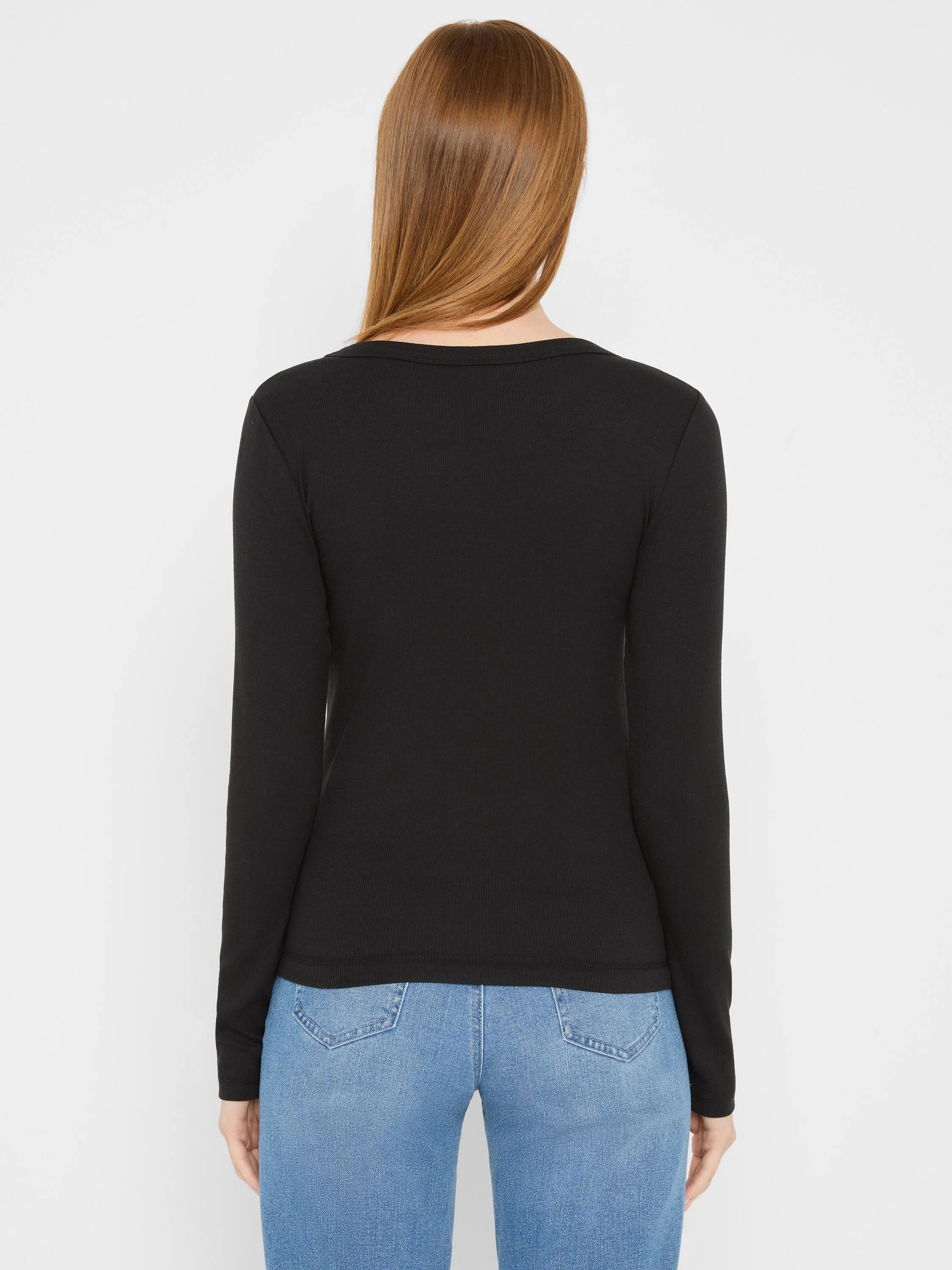 Black ribbed knit long sleeve crew neck tee, fitted, viewed from the back on a model.