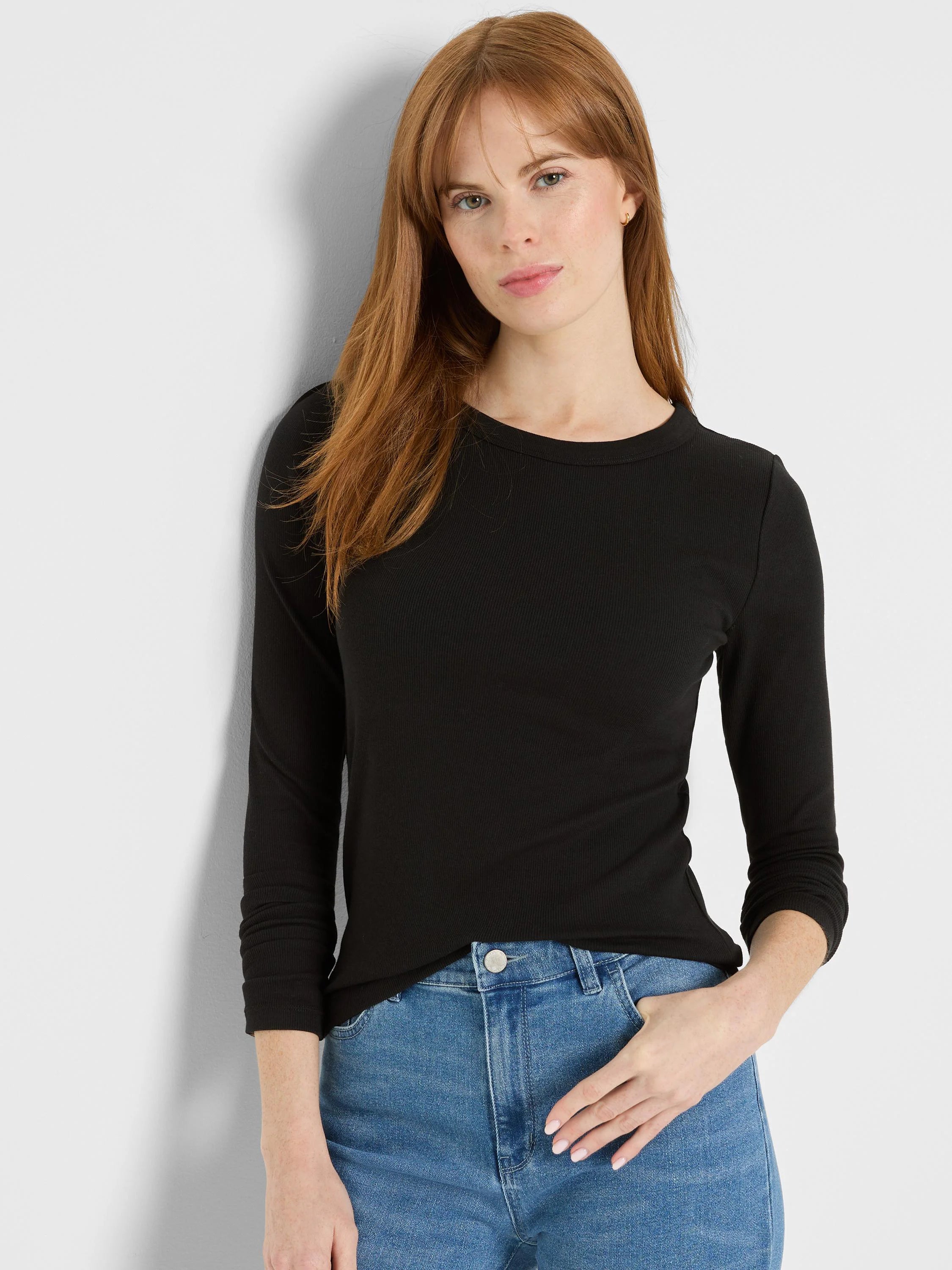 Black, ribbed knit long-sleeve tee with a crew neck and a fitted silhouette.