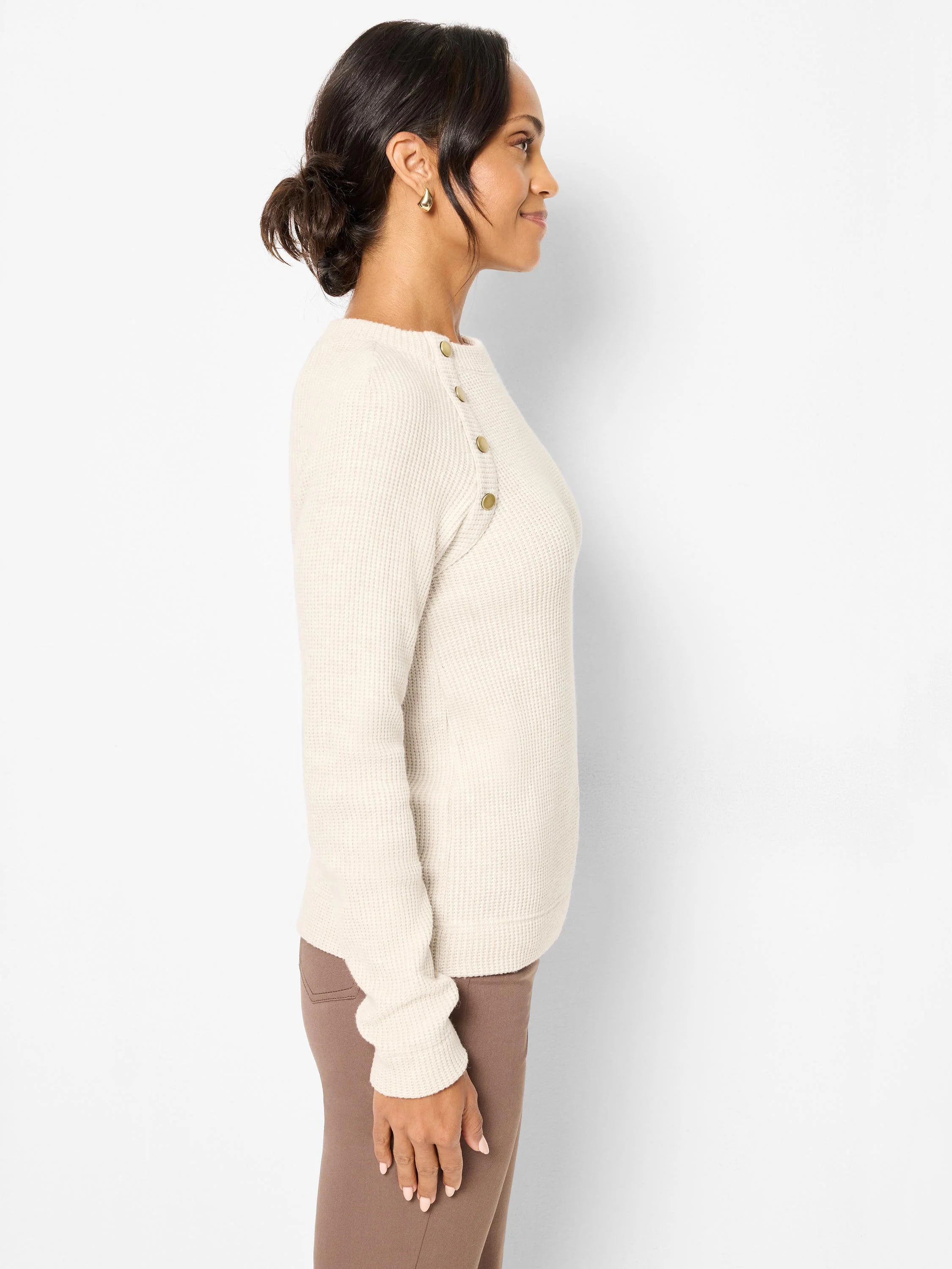 Cream waffle knit thermal top with gold buttons on the left shoulder.