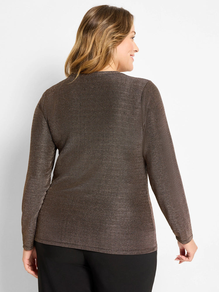 Woman in dark brown long-sleeve knit top with subtle metallic flecks, viewed from the back.