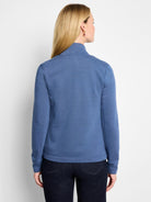 Muted blue knit jacket with a mock neck, long sleeves, and ribbed hem, shown from the back.