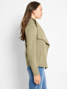 Olive green Lounge Around Moto Jacket on a model. Features a draped collar and vertical slit pocket.