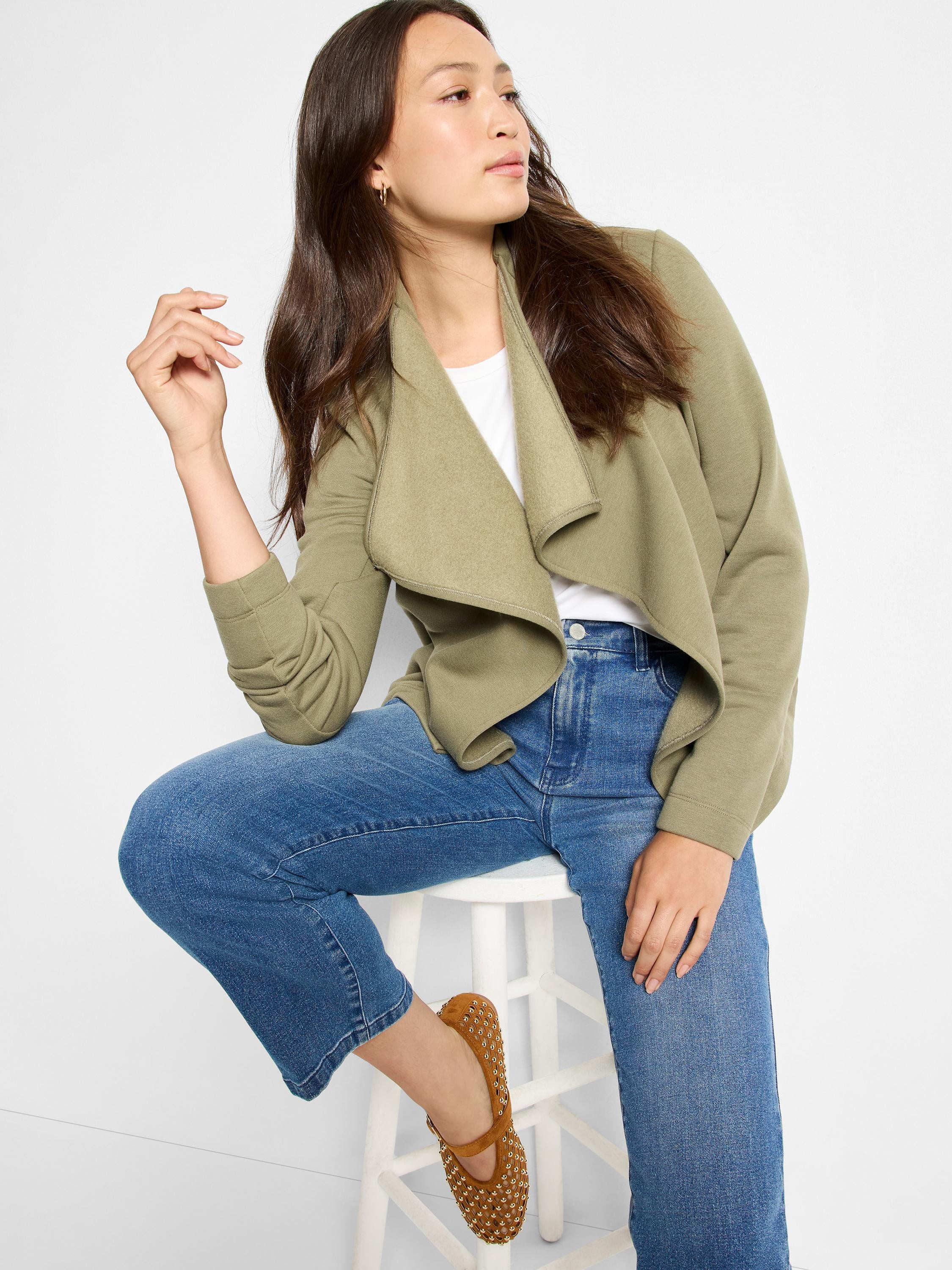 Soft olive green knit jacket with wide, draped lapels and an open front.