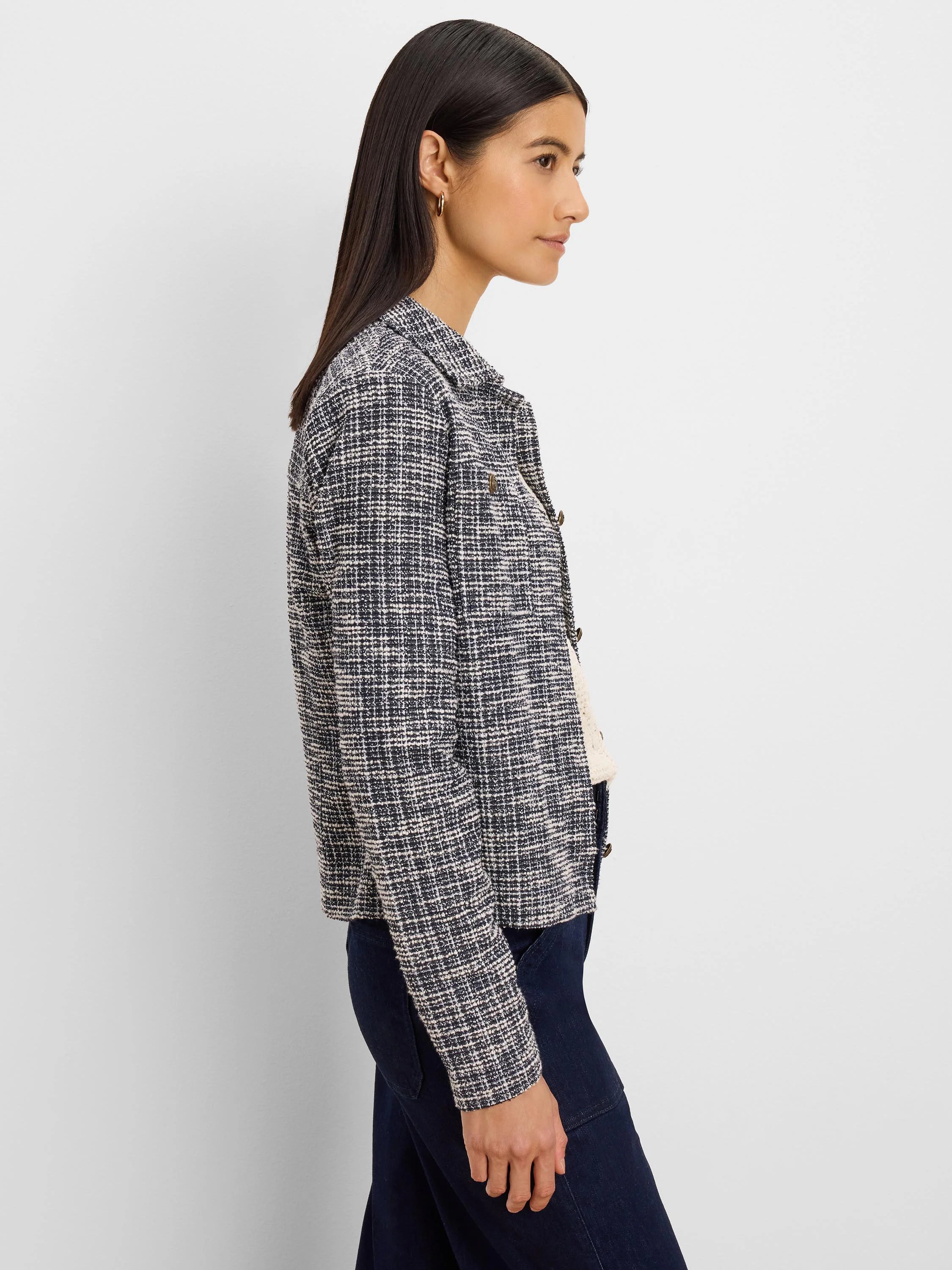 Cropped navy & cream tweed knit jacket with a collar and gold buttons.
