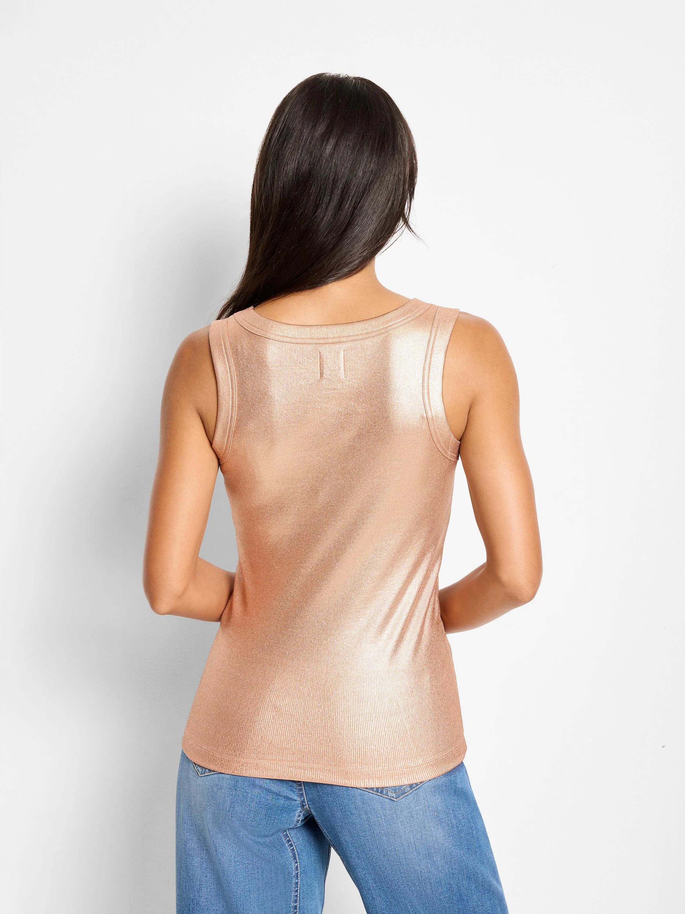 Shimmery rose gold ribbed tank top, shown from the back on a model. Fine vertical ribbing is visible.