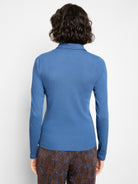 Back view of a fitted blue rib knit long-sleeve polo shirt with a collar.