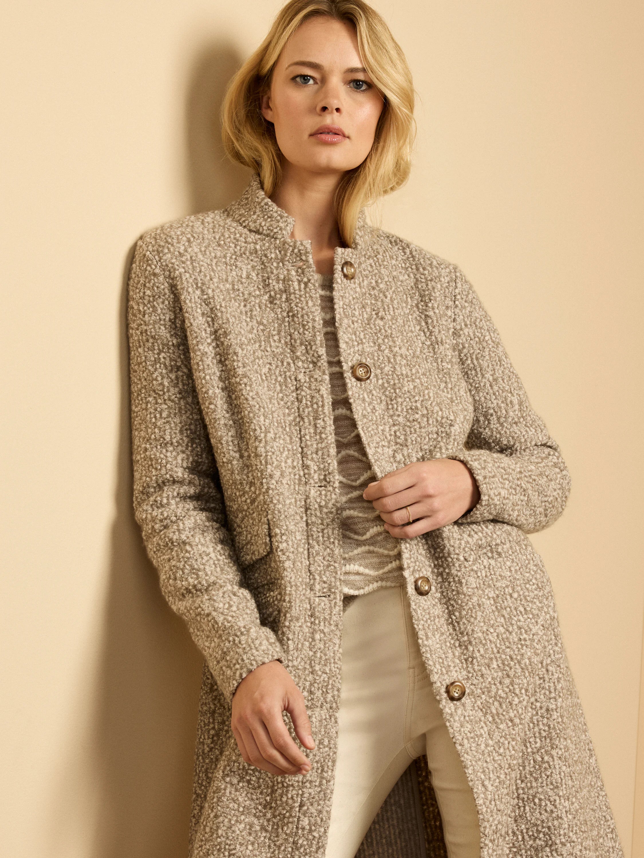 Collarless oatmeal heathered sherpa tweed knit topcoat with dark brown buttons.