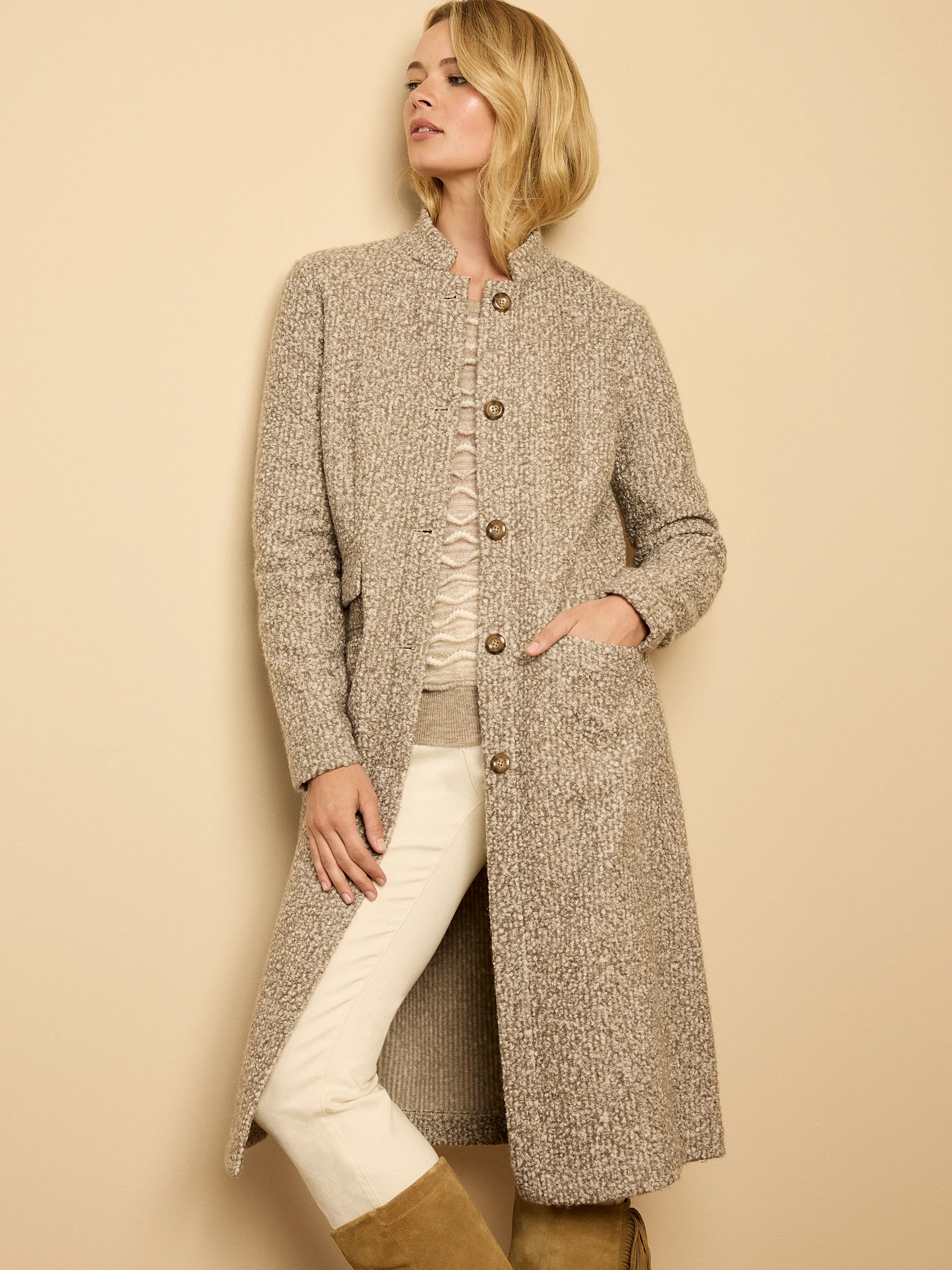Long, collarless sherpa tweed knit topcoat in heathered tan and cream with brown buttons and patch pockets.