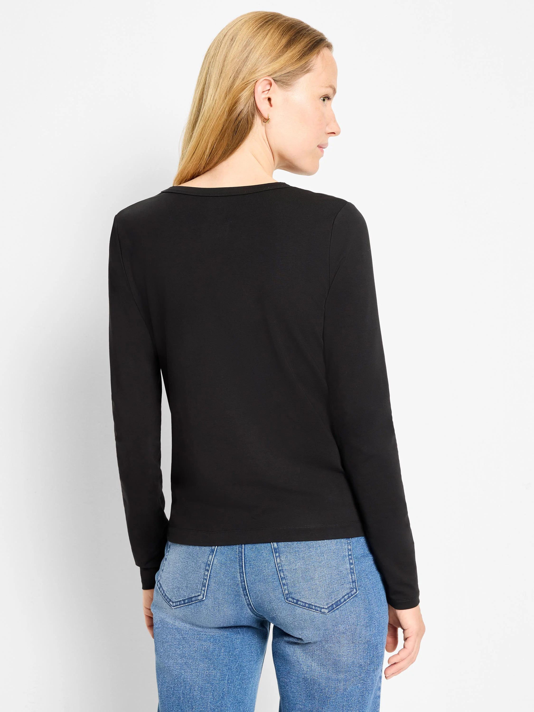 Black knit long-sleeve top with a crew neck, shown on a model from behind.
