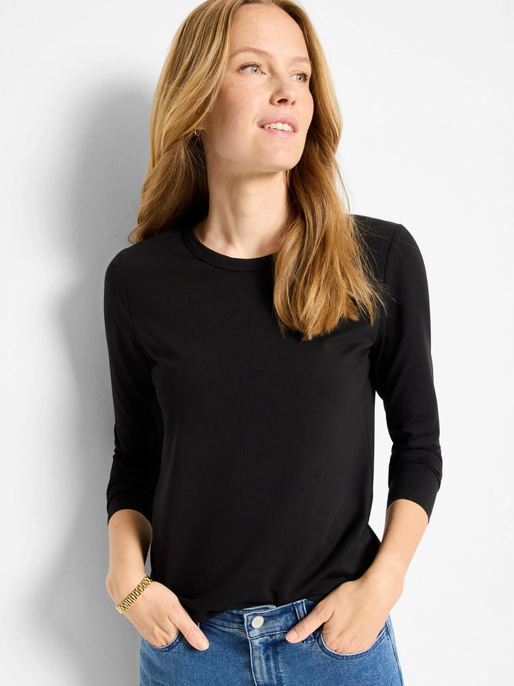 Black, fitted crew neck long sleeve top.