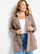 Taupe mid-length jacket with a collar and silver front snaps, worn open.