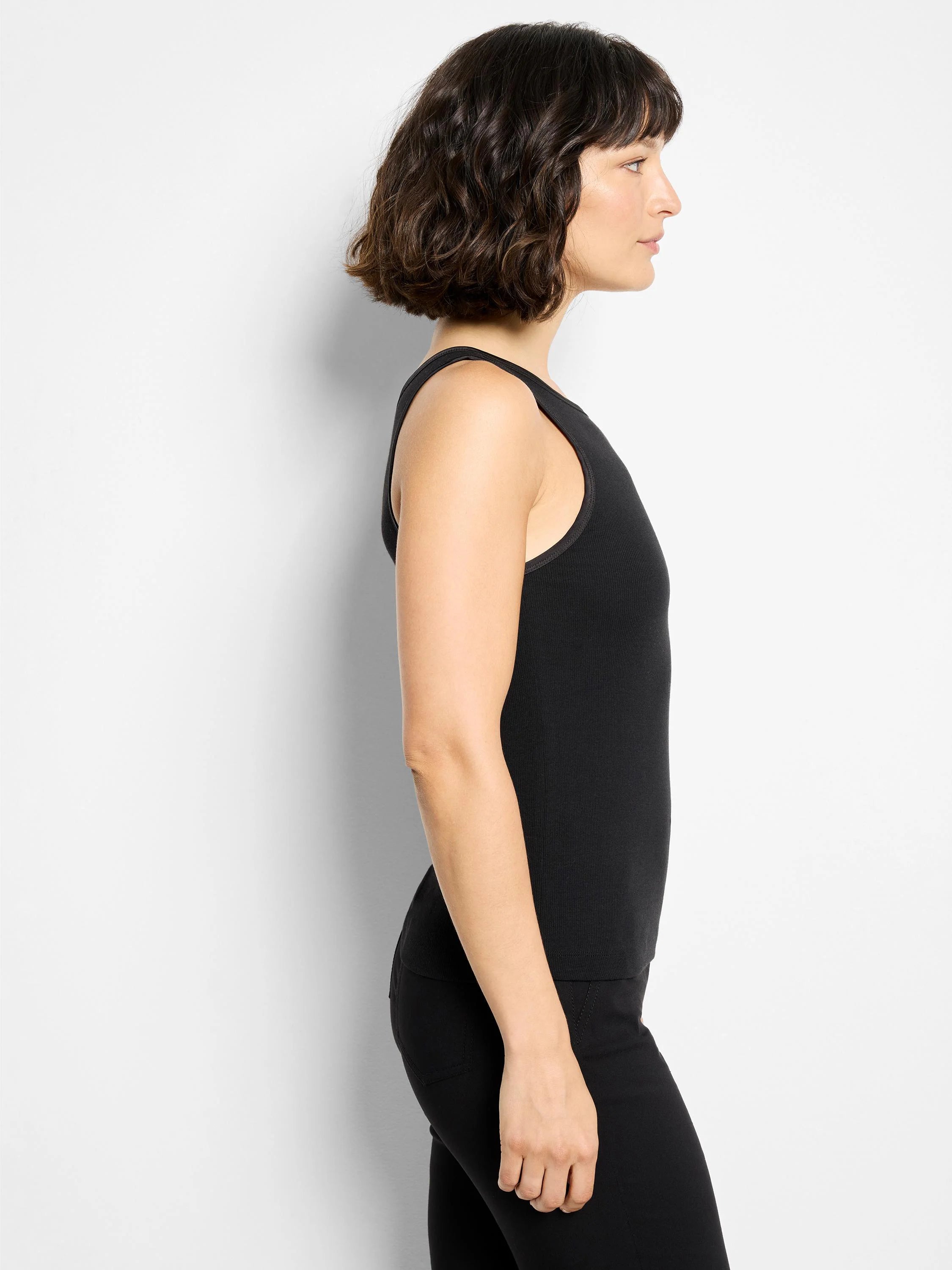 Black, ribbed knit tank top with a close fit.