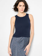 Navy blue ribbed knit tank with a round neck, sleeveless cut, and dark satin trim.