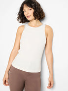 Off-white ribbed tank top with light grey trim on the high crew neck and armholes.