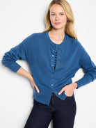 Teal blue knit cardigan with round neck, ribbed cuffs & hem, and coordinating snap buttons.