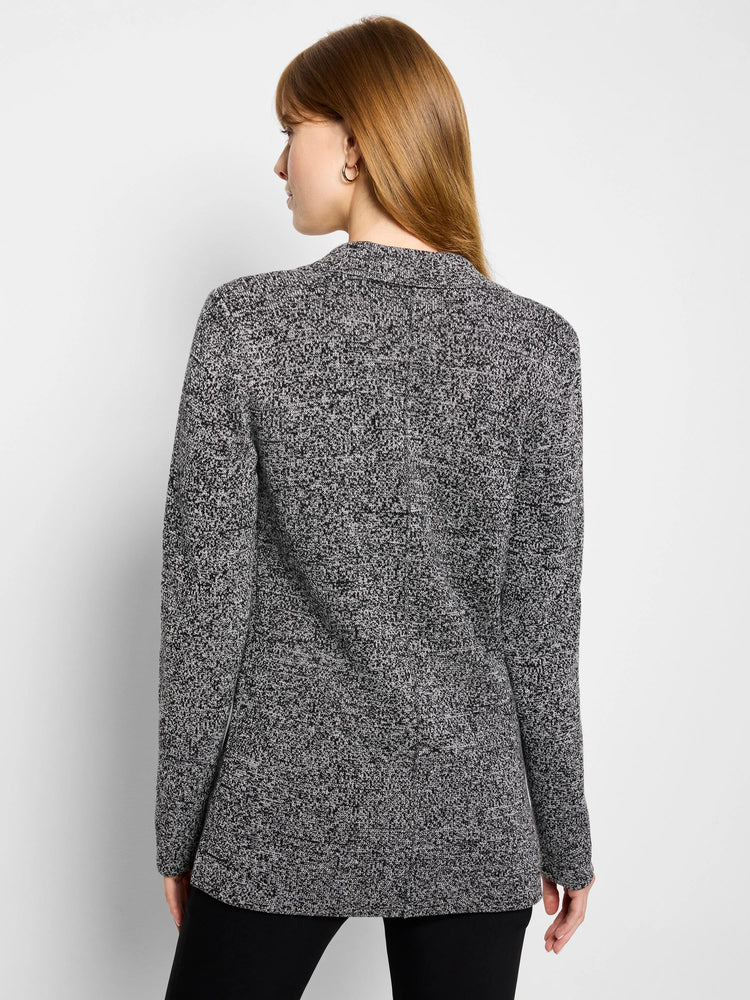 Black and white speckled knit blazer with a collar and long sleeves, shown from behind.