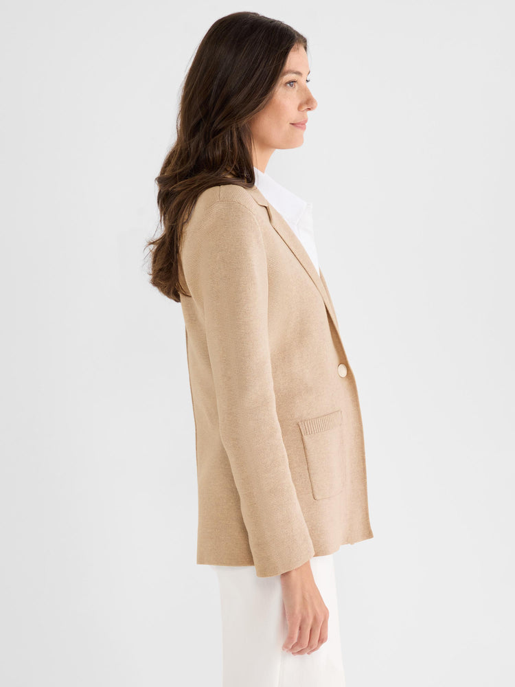 A tan knit blazer featuring a classic fit, notch lapels, a single button closure, and a front patch pocket.