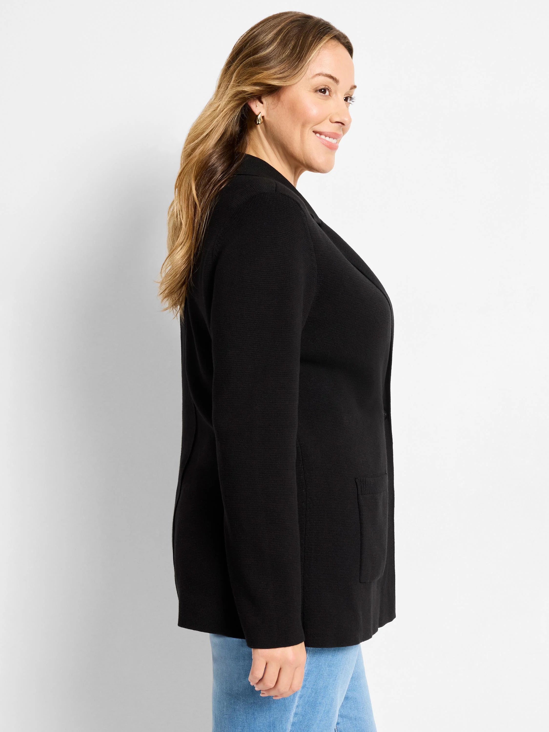 Black knit blazer with lapels and patch pockets.