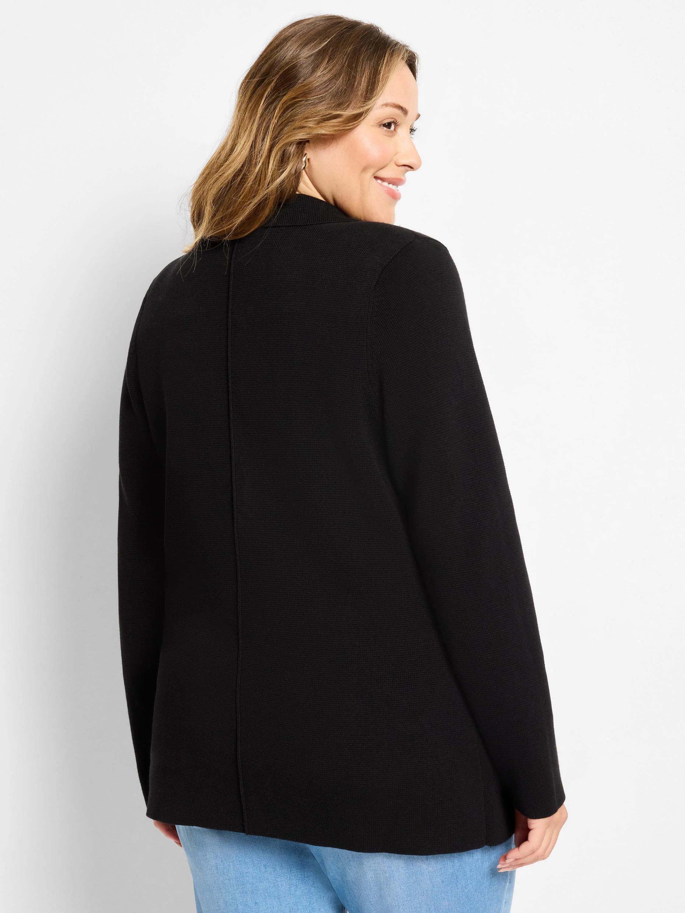 Black knit blazer with a subtle textured weave, long sleeves, and hip-length. Model shown from the back.