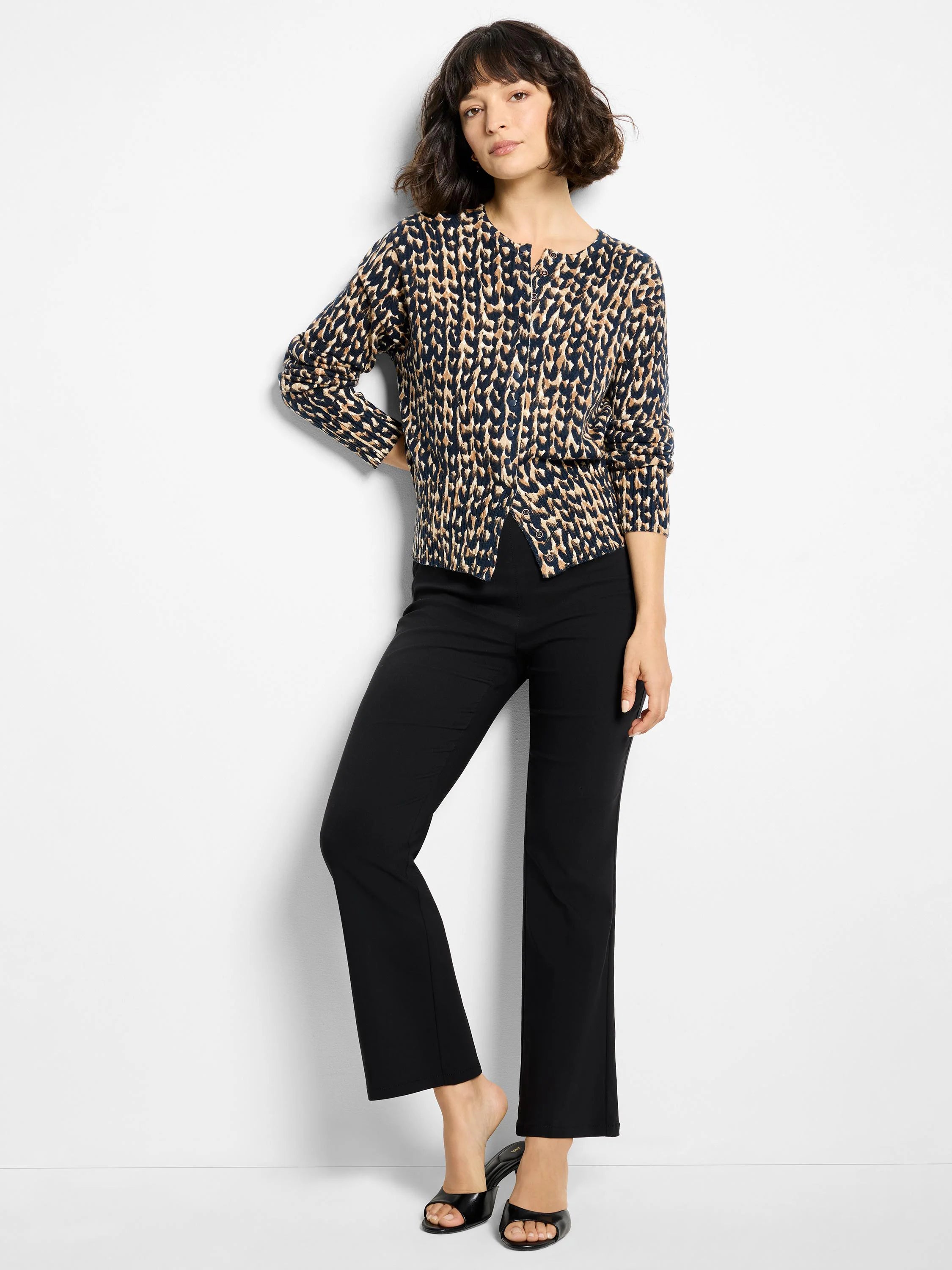 Navy and tan stitch print snap-front cardigan with a round neck and long sleeves.