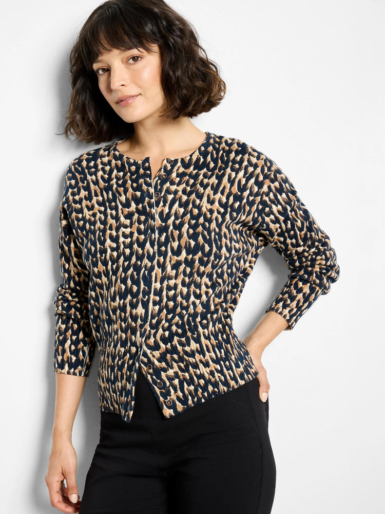 Round neck cardigan in navy and tan leopard print, featuring snap front closure.