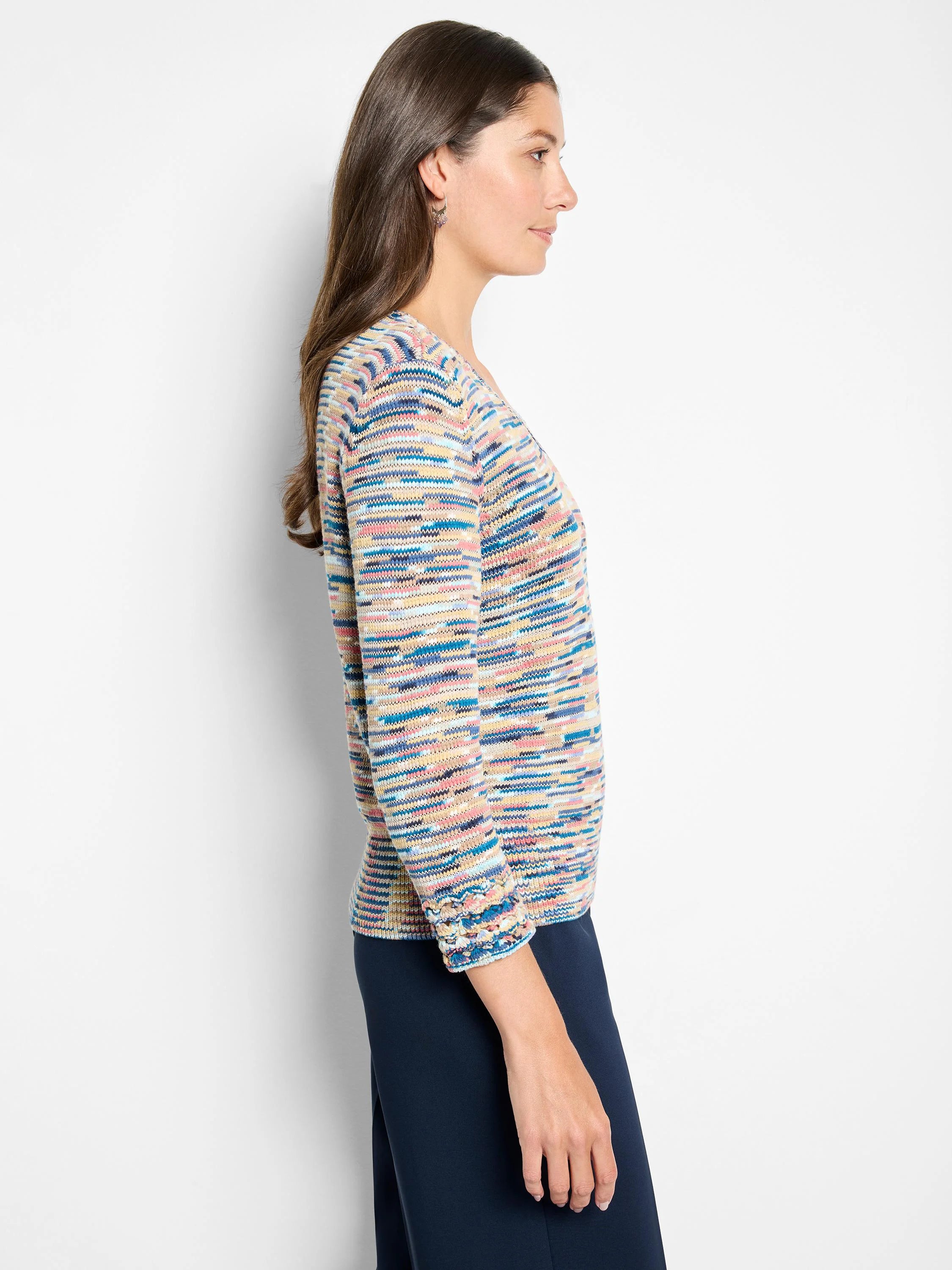 V-neck sweater with variegated knit horizontal stripes in blue, pink, yellow, and cream. Features textured cuffs.
