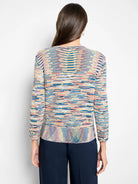 V-neck sweater: multi-color knit with wavy horizontal stripes (blue, pink, yellow). Back view.