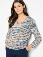 V-neck knit sweater with mixed blue, pink, yellow, and tan yarns creating horizontal stripes.