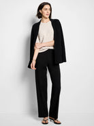 Light cream short-sleeve sweater tee with a subtle, raised knit texture and round neck.