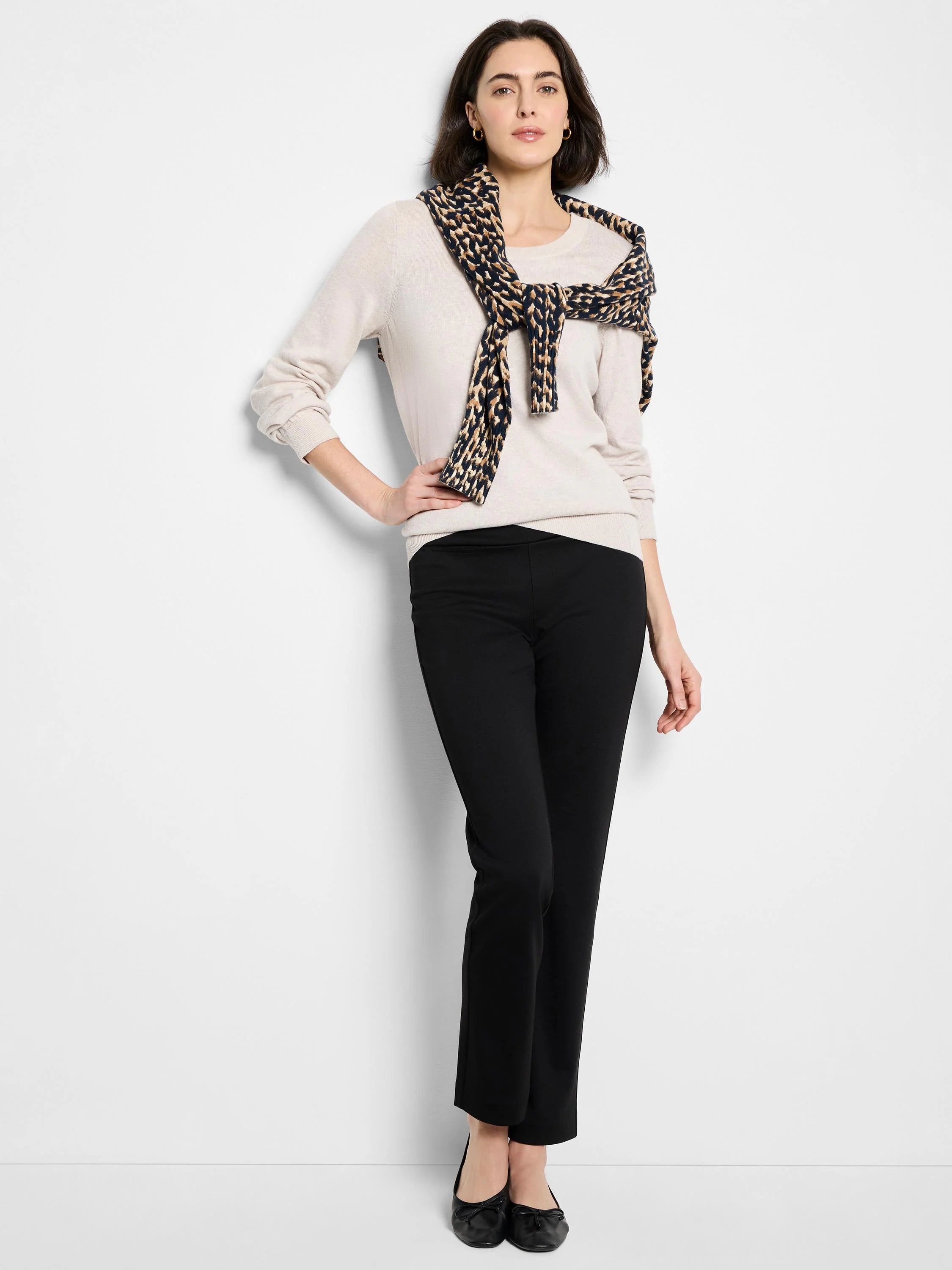 Oatmeal long-sleeve crew neck sweater with ribbed cuffs and hem, worn by a model.