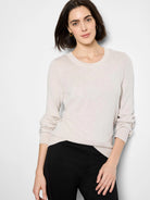 Light beige pure cotton crew neck sweater with ribbed cuffs.