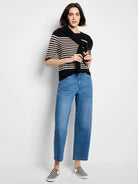 Black and cream horizontal striped sweater tee with elbow-length sleeves and a crew neck.