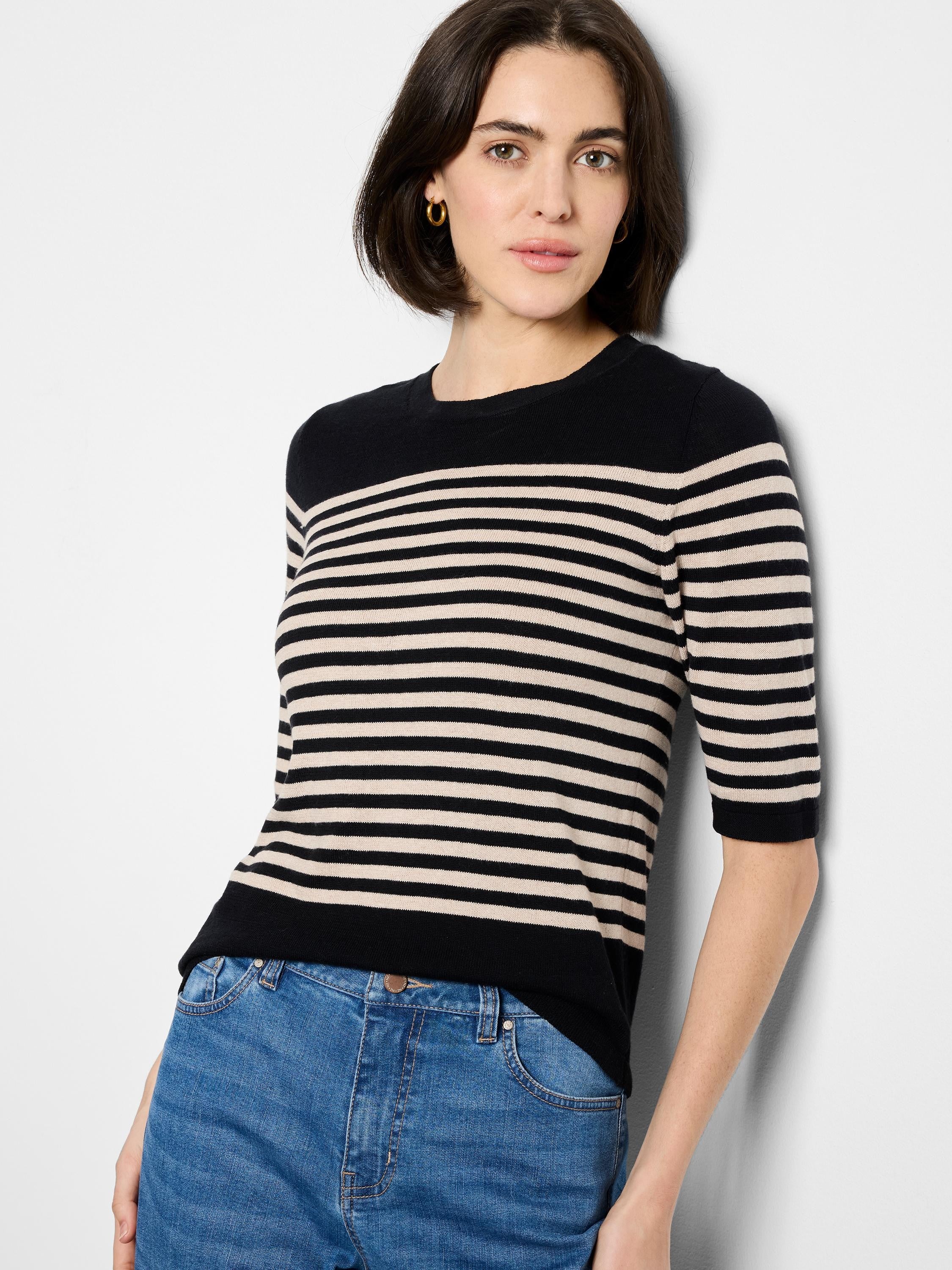 Black and beige horizontally striped sweater tee with elbow-length sleeves.