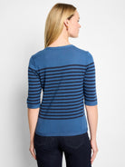 Medium blue sweater tee with navy horizontal stripes and 3/4 sleeves, seen from the back.