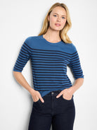 Medium blue sweater tee with navy horizontal stripes, crew neck, and elbow-length sleeves.