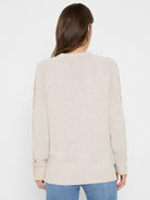 Light beige sweater, back view, with tan ruffles along the long raglan sleeves.