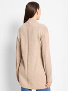 Speckled beige knit with vertical plaited details on back and sleeves. Features ribbed collar, cuffs, and hem.