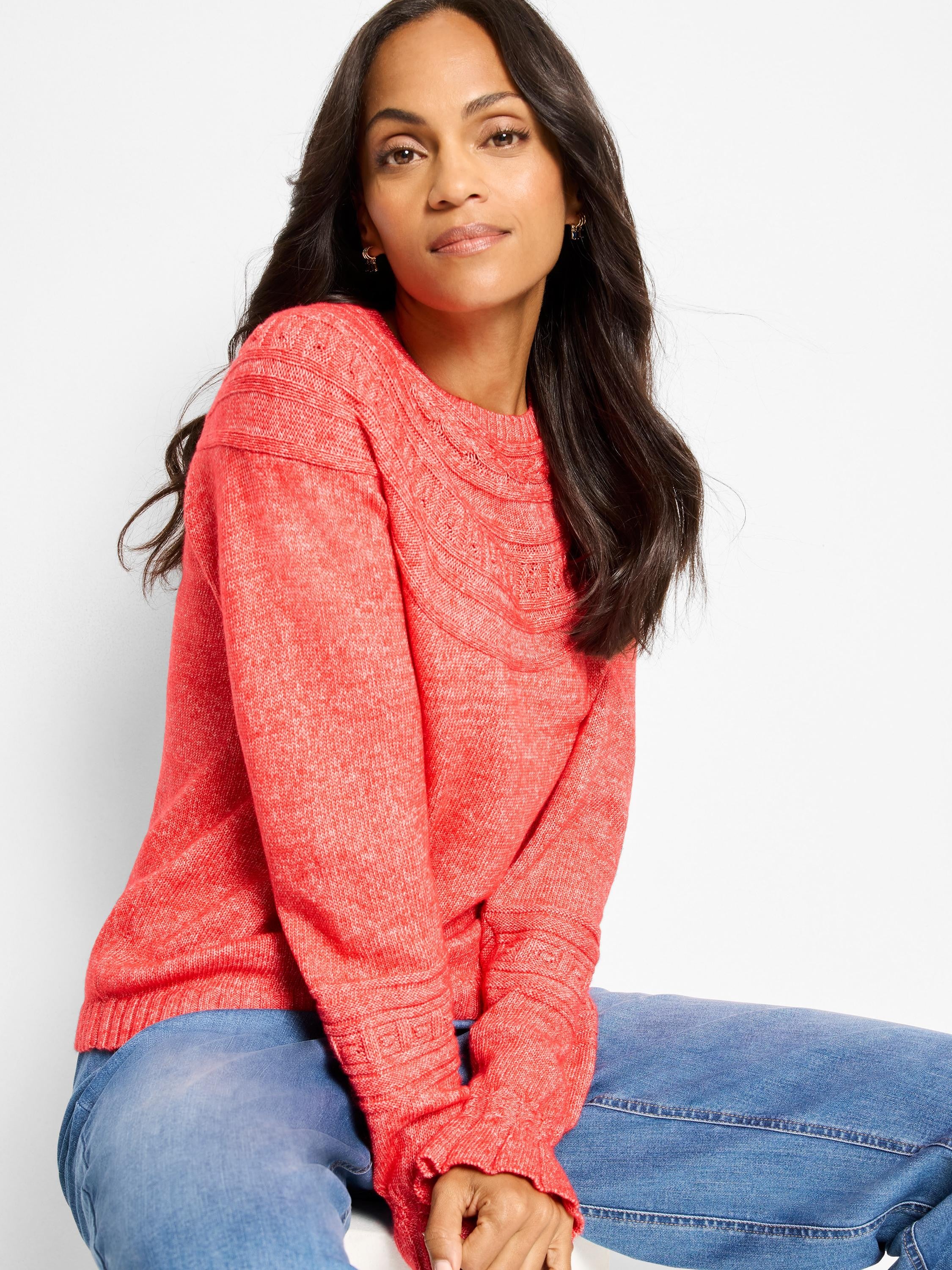 Heather coral crewneck sweater with textural dot knit pattern on neckline and cuffs.