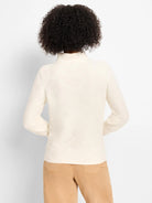 Cream high-neck sweater with a raised diamond texture and long sleeves, shown from the back on a model.