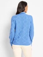 Blue sweater with a raised diamond texture pattern, back view.