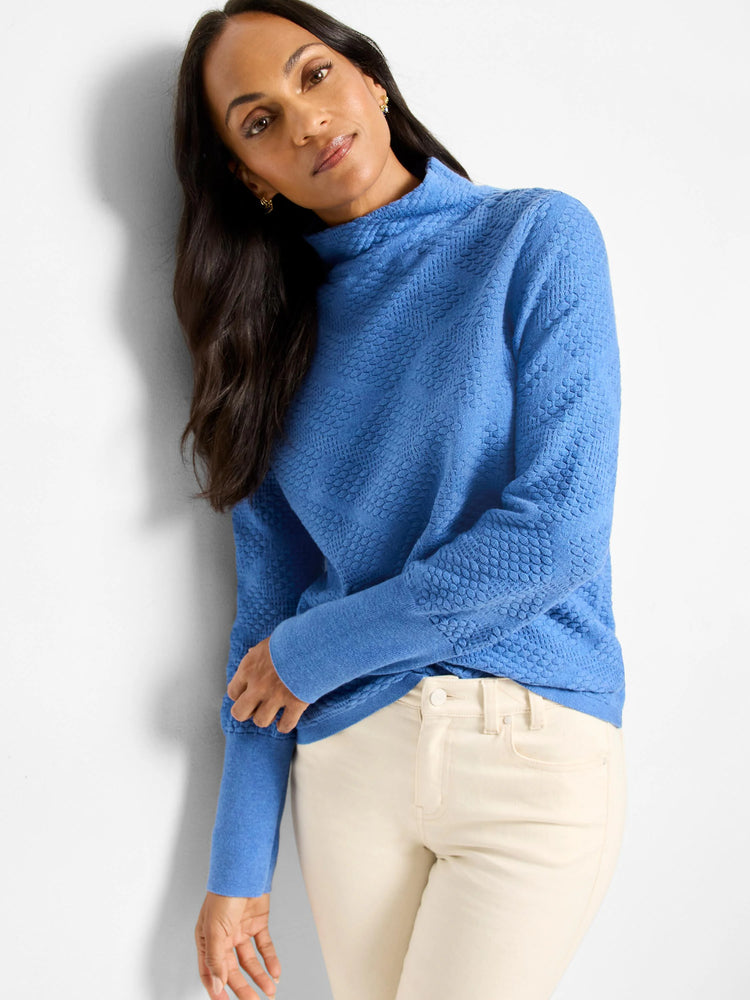 Blue mock neck sweater with an all-over raised diamond texture.