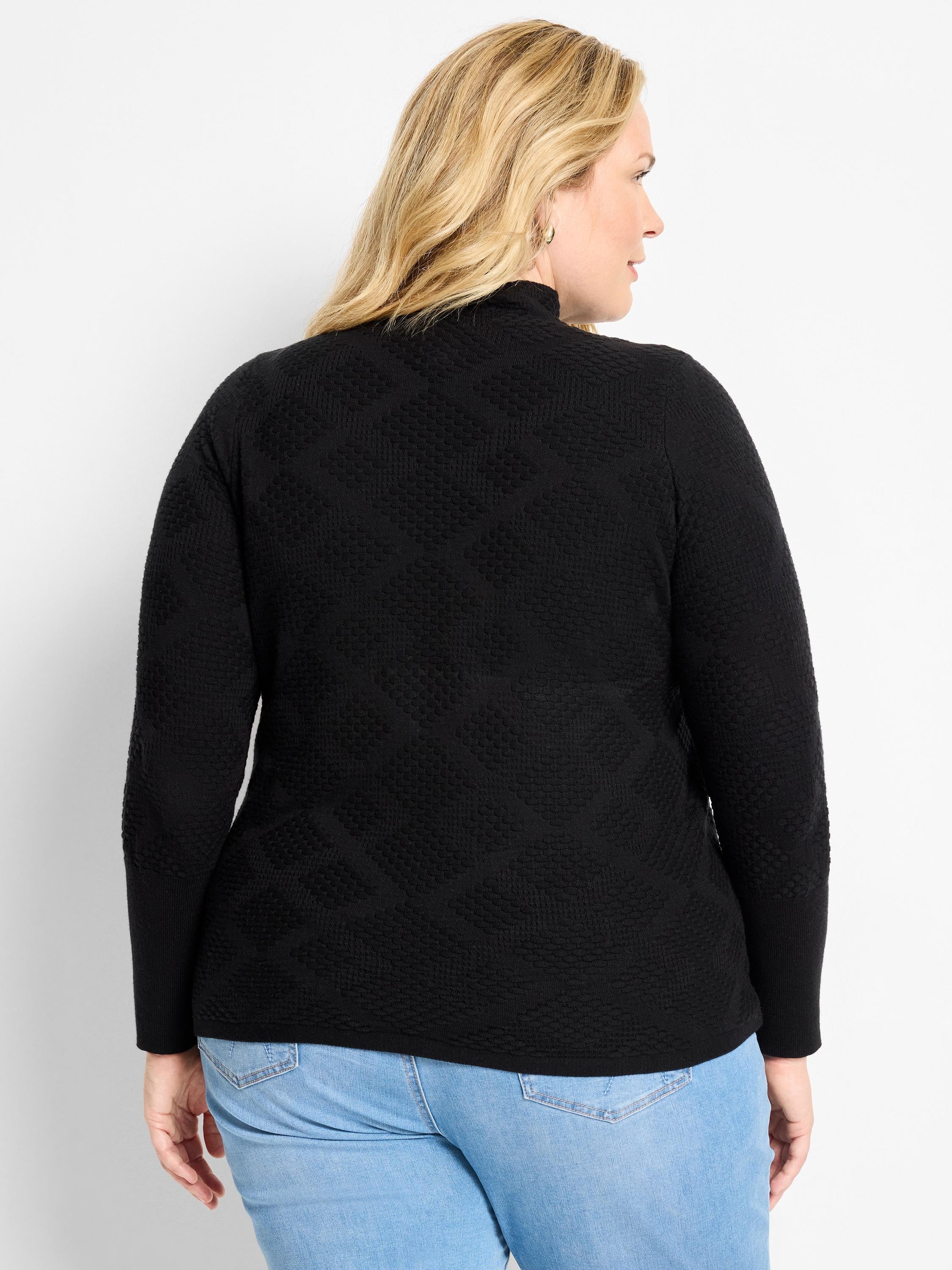 Black textured diamond sweater with mock neck and long sleeves.
