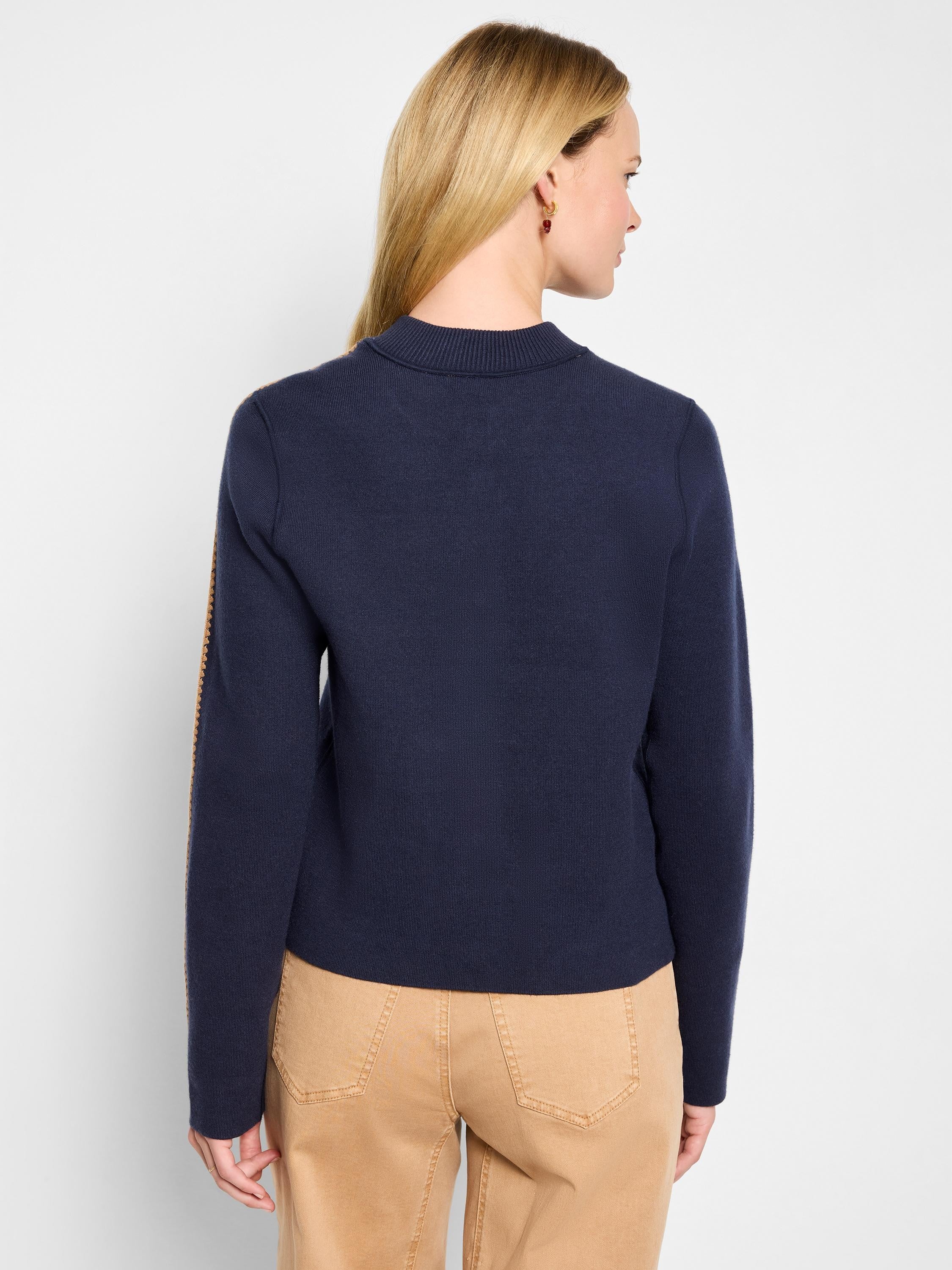 Navy knit bomber jacket with ribbed collar, featuring tan stripes on outer sleeves. Back view.